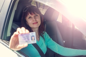 Woman shows a driver's license