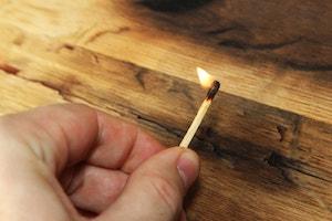 Man holding lit match